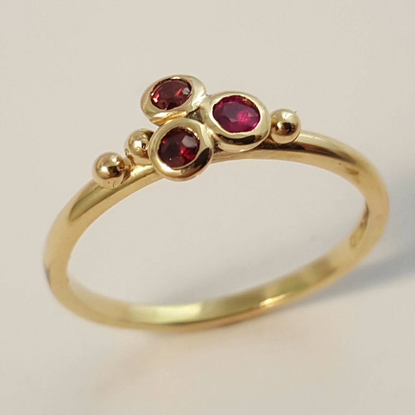 Package A: 18ct yellow gold with 3 ruby cluster