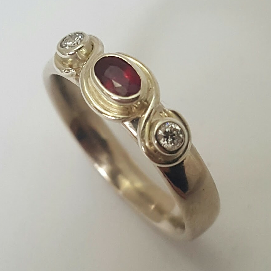 Package A: 9ct white gold swirl ring with bezel set oval ruby cabachon and pair of diamonds