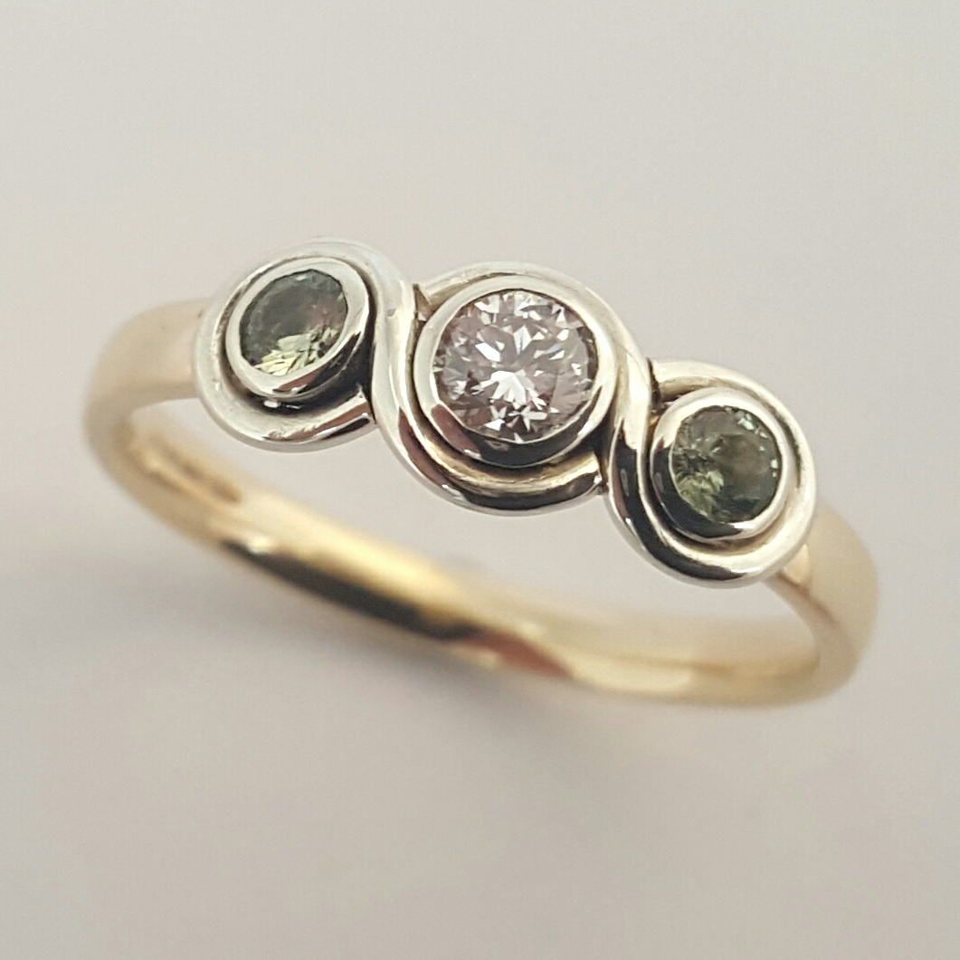 Package A: 9ct yellow and white gold ring with bezel set diamond and green tourmaline